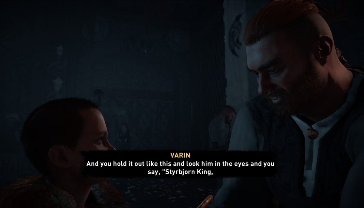 A man looking down as a small boy in a dimly lit room. subtitles are clear and contract well with the background, stating Varin (in yellow): And you holt it out like this and look him in the eyes and you say, "Styrbjorn King."
