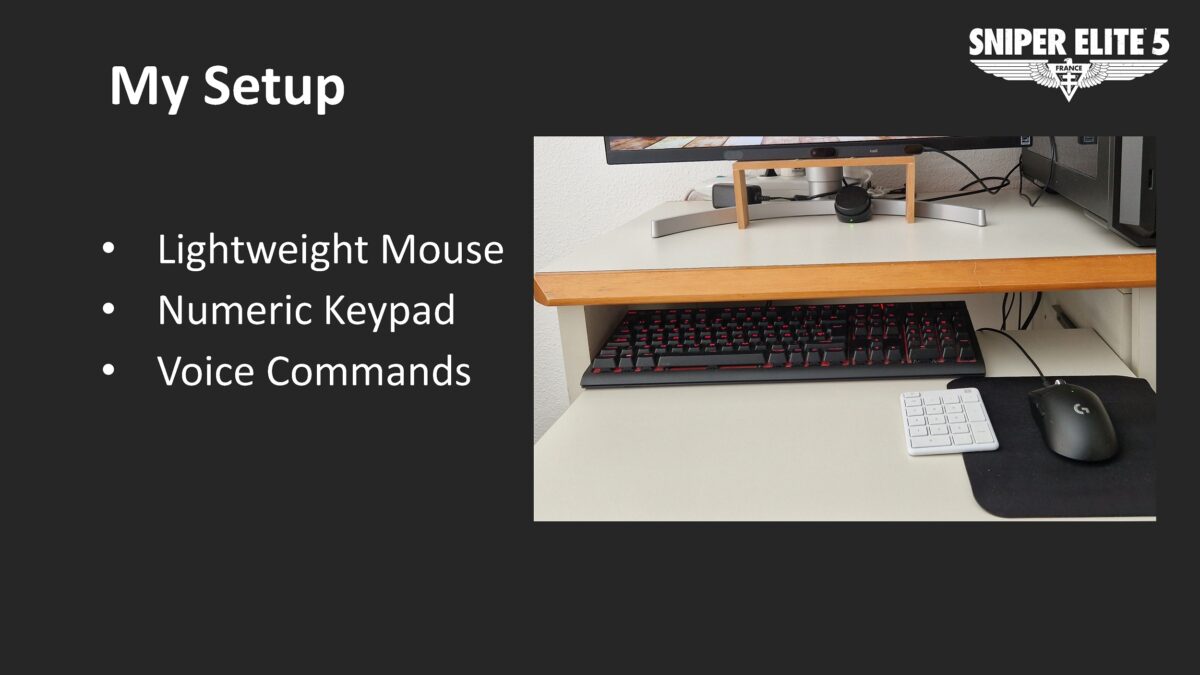 A page with white text on a dark grey background. There is a picture of a desktop with a small numeric keypad and a mouse. The bullet point list reads: Lightweight Mouse. Numeric Keypad. Voice Commands