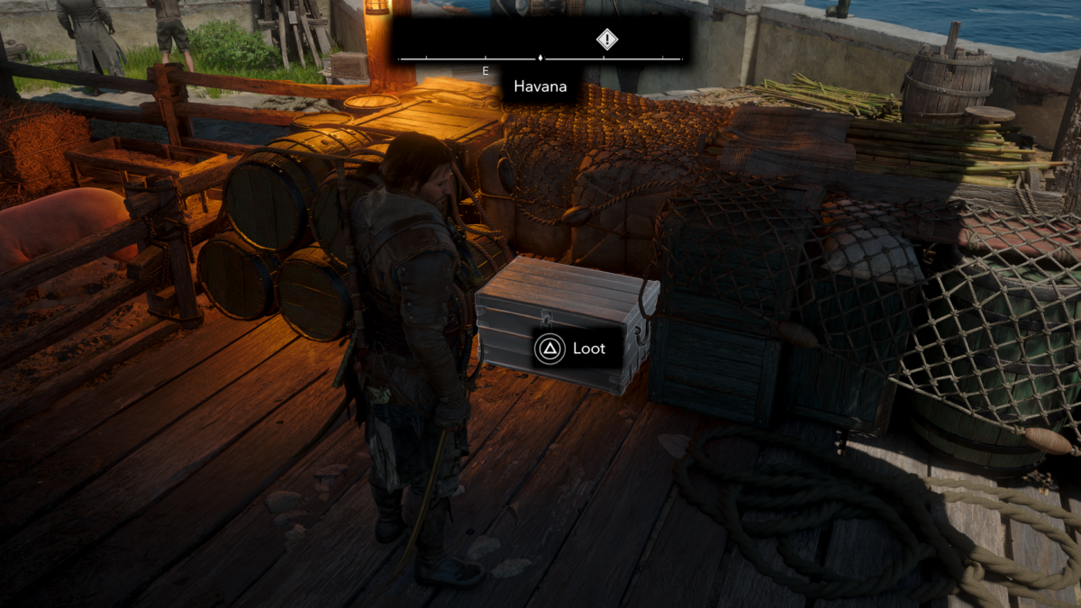 Gameplay screenshot of the protagonist standing on a wooden dock next to stacked cargo crates and barrels. A highlighted silver treasure chest sits on the floor with a prompt reading "Triangle Loot".